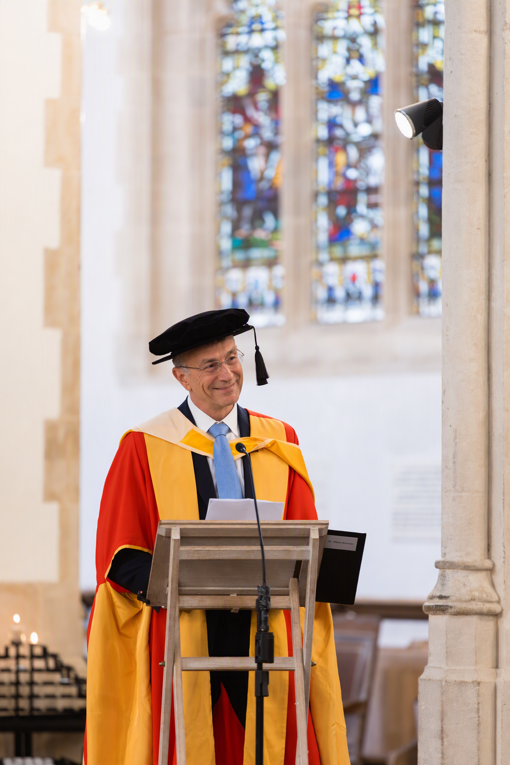 Dr Nikos Savvas smiling at graduation ceremony