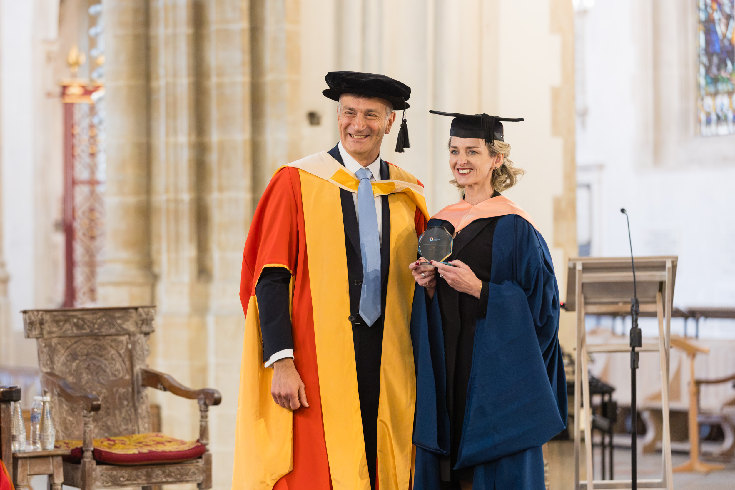 Dr Nikos Savvas alongside a female graduate