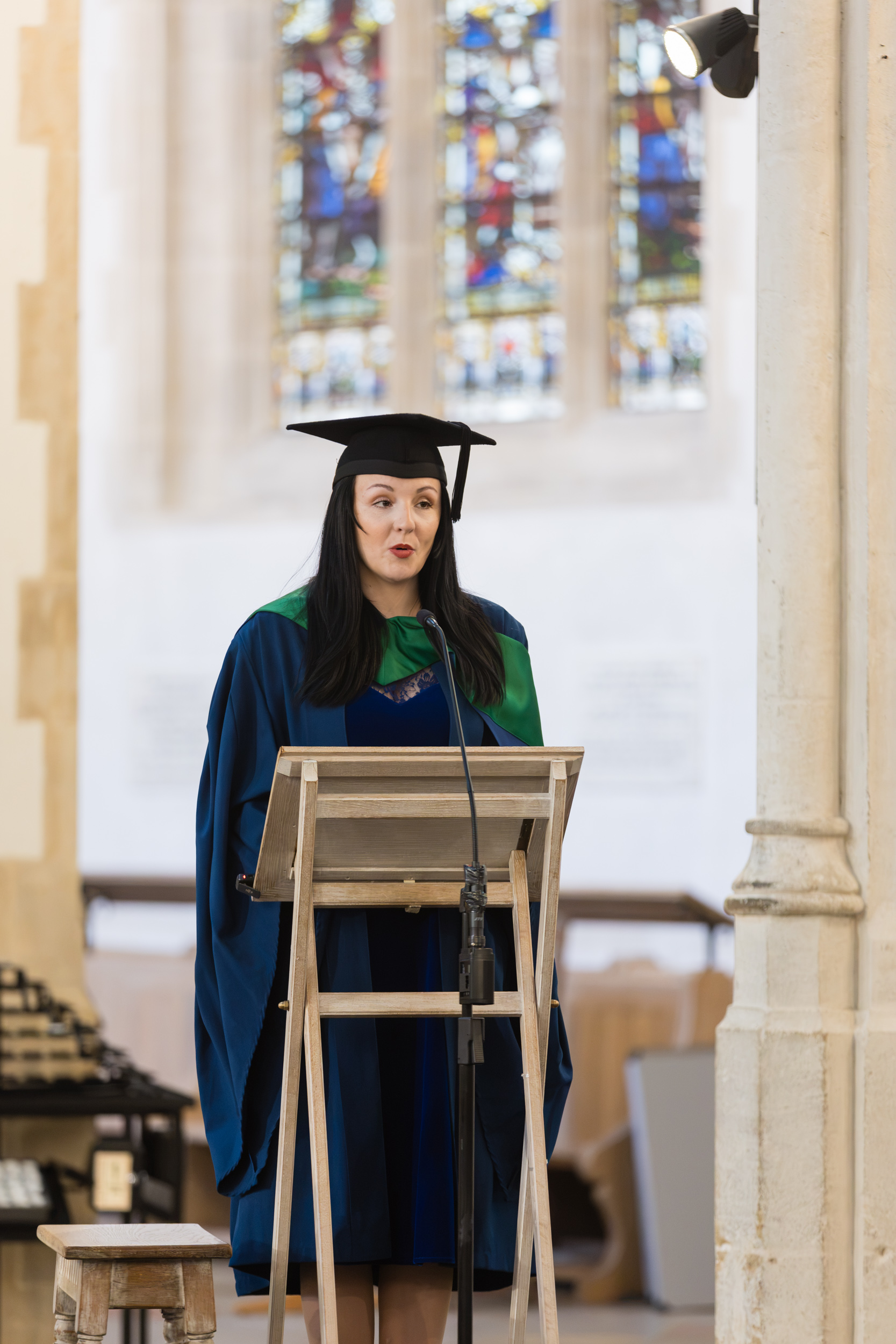 A graduate speaking to an audience