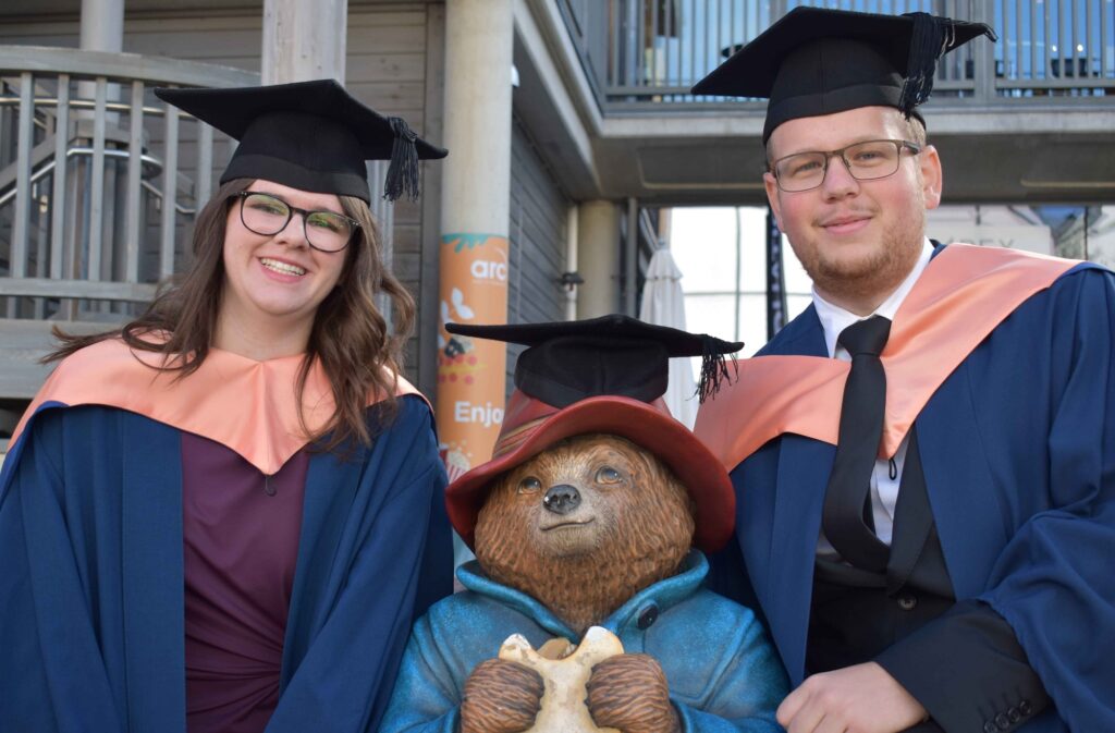 Amy Hale and Aflie Woolgar with Paddington outside The Apex - Amy and Alfie met and fell in love whilst studying their degree at University Studies at West Suffolk College