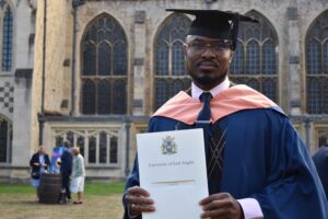 Yunus Njie with his business degree from UEA that he gained whilst studying at University Studies at West Suffolk College