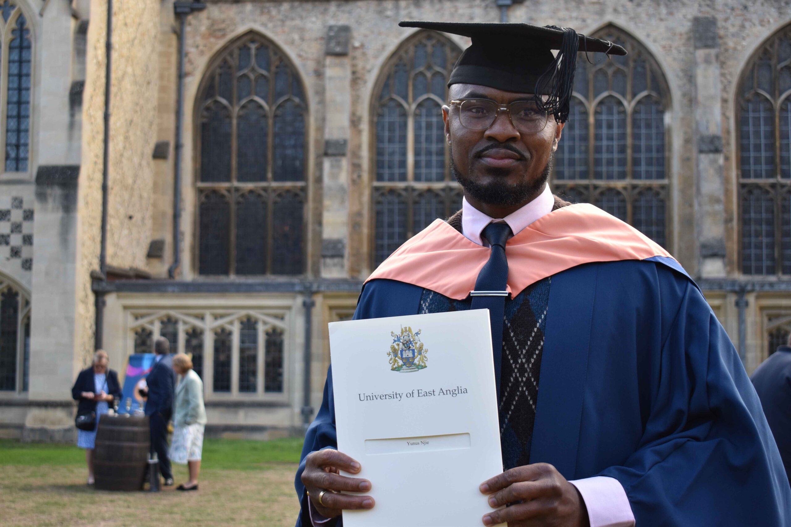 Yunus Njie with his business degree from UEA that he gained whilst studying at University Studies at West Suffolk College