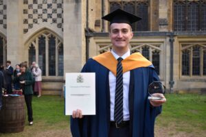 Andrew Fletcher with his degree and award from University Studies at West Suffolk College
